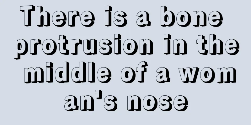 There is a bone protrusion in the middle of a woman's nose