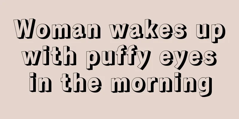 Woman wakes up with puffy eyes in the morning