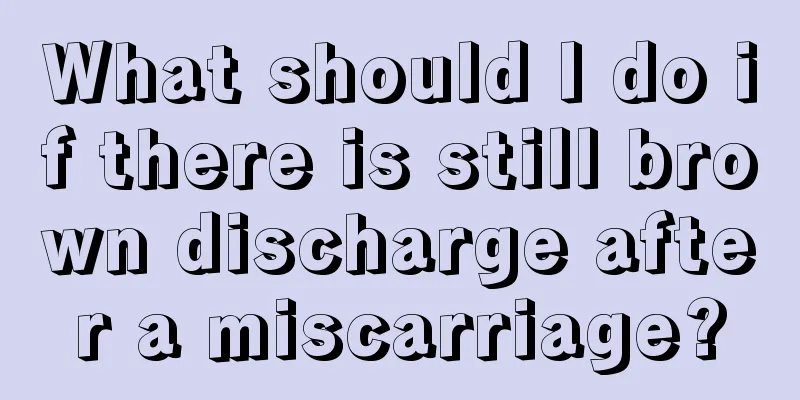 What should I do if there is still brown discharge after a miscarriage?