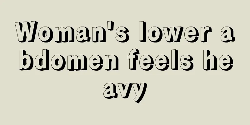 Woman's lower abdomen feels heavy