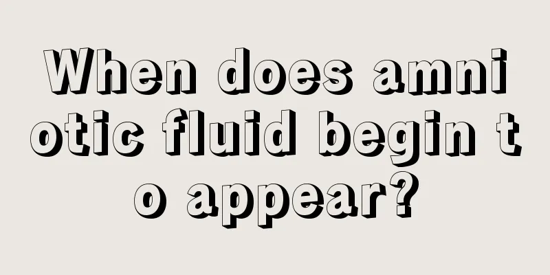 When does amniotic fluid begin to appear?