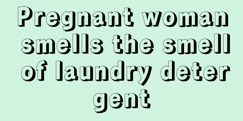 Pregnant woman smells the smell of laundry detergent