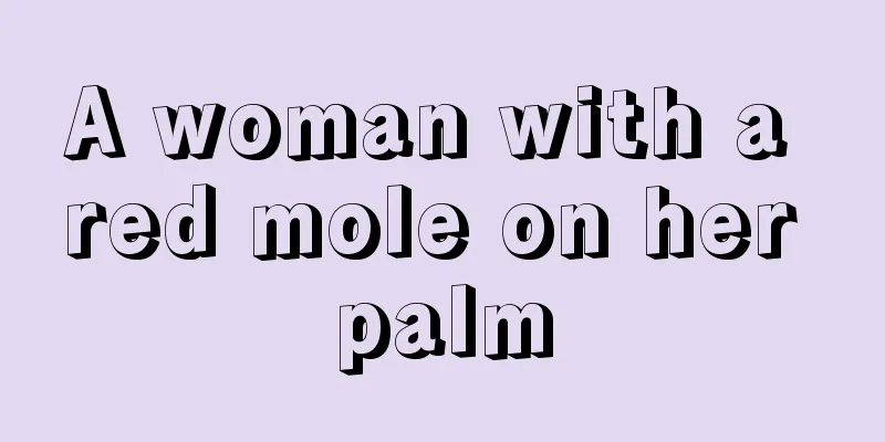 A woman with a red mole on her palm