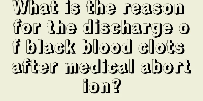 What is the reason for the discharge of black blood clots after medical abortion?