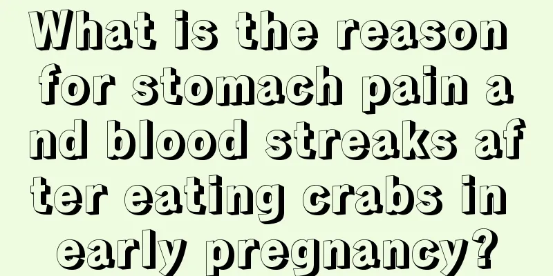 What is the reason for stomach pain and blood streaks after eating crabs in early pregnancy?