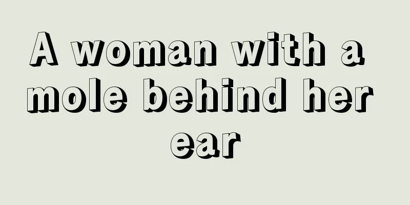 A woman with a mole behind her ear