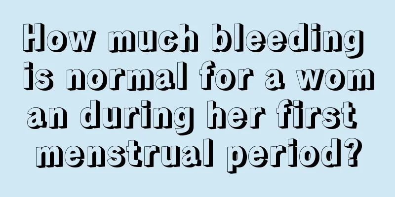 How much bleeding is normal for a woman during her first menstrual period?