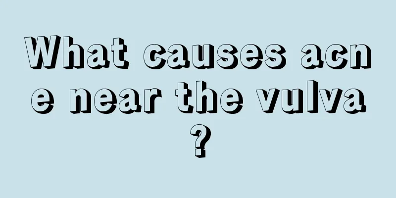 What causes acne near the vulva?