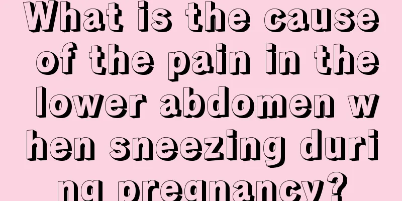 What is the cause of the pain in the lower abdomen when sneezing during pregnancy?