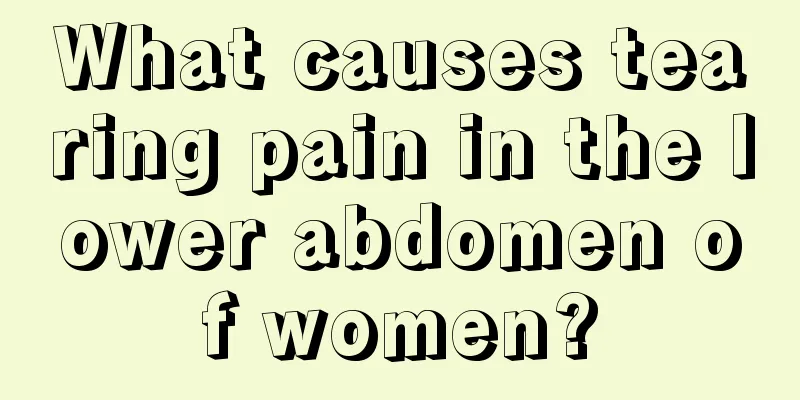 What causes tearing pain in the lower abdomen of women?