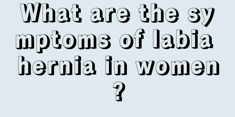 What are the symptoms of labia hernia in women?