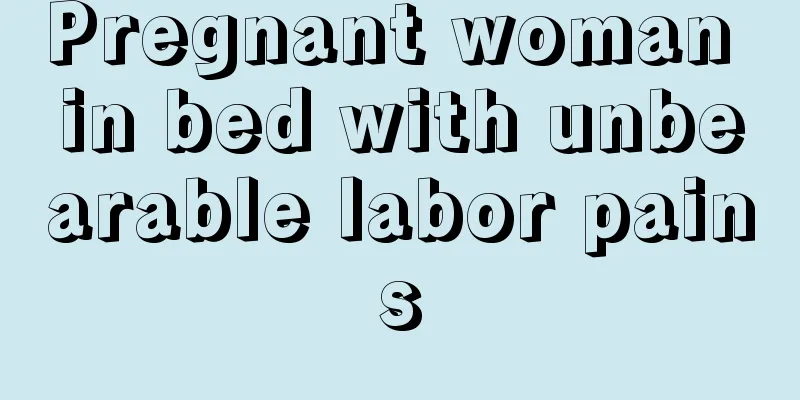 Pregnant woman in bed with unbearable labor pains