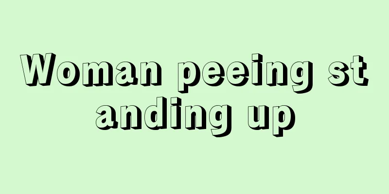 Woman peeing standing up