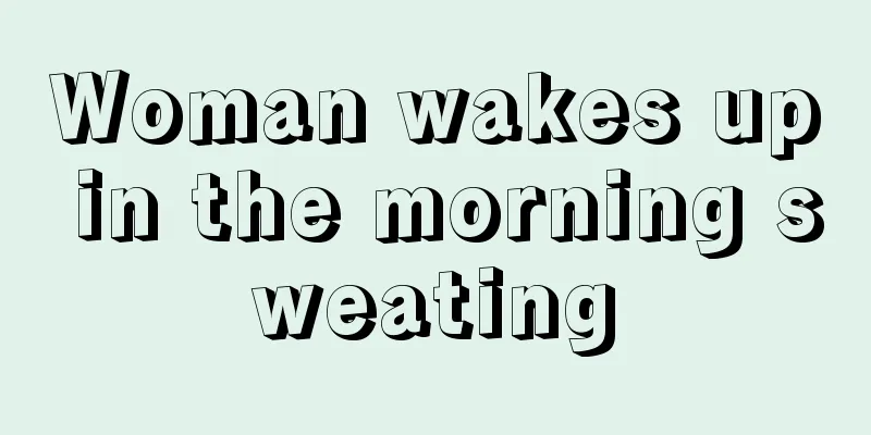 Woman wakes up in the morning sweating