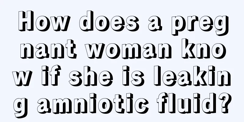 How does a pregnant woman know if she is leaking amniotic fluid?