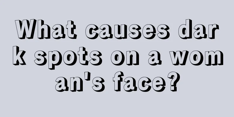 What causes dark spots on a woman's face?