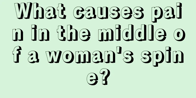 What causes pain in the middle of a woman's spine?