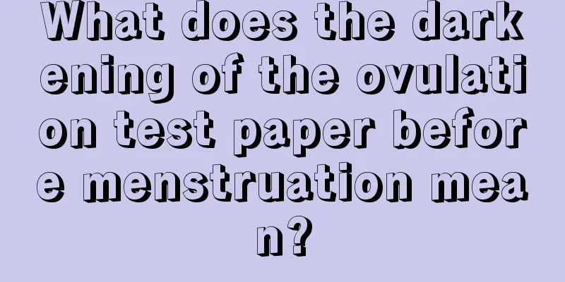 What does the darkening of the ovulation test paper before menstruation mean?