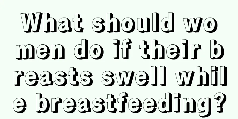 What should women do if their breasts swell while breastfeeding?