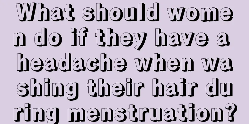 What should women do if they have a headache when washing their hair during menstruation?