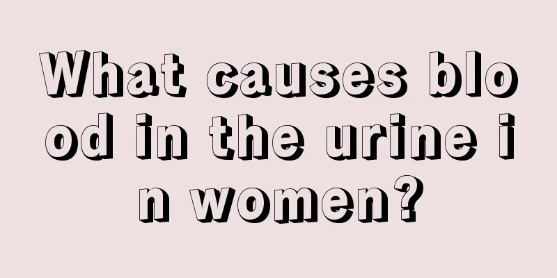 What causes blood in the urine in women?