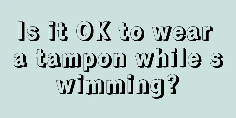 Is it OK to wear a tampon while swimming?