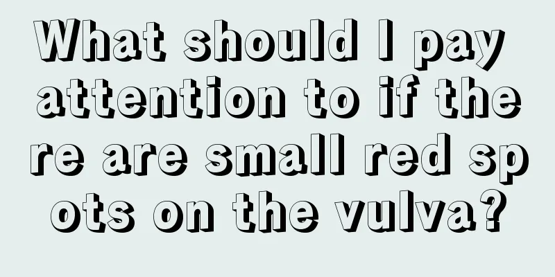 What should I pay attention to if there are small red spots on the vulva?