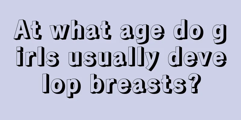 At what age do girls usually develop breasts?