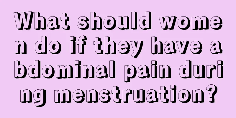 What should women do if they have abdominal pain during menstruation?