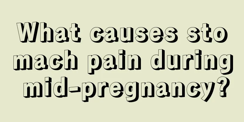 What causes stomach pain during mid-pregnancy?