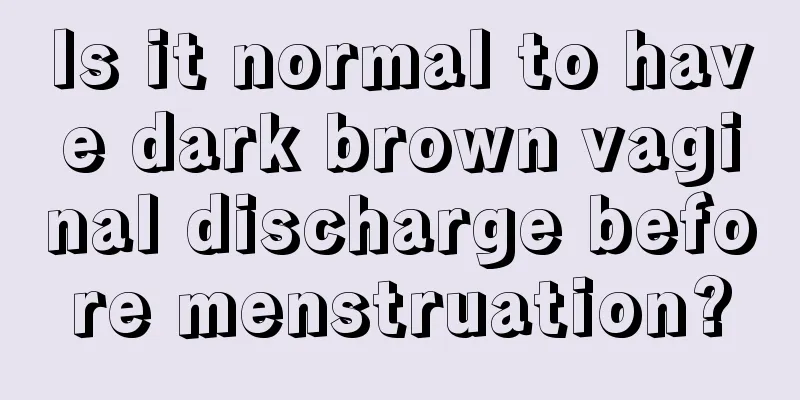 Is it normal to have dark brown vaginal discharge before menstruation?