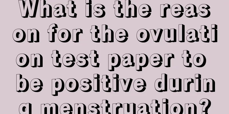 What is the reason for the ovulation test paper to be positive during menstruation?