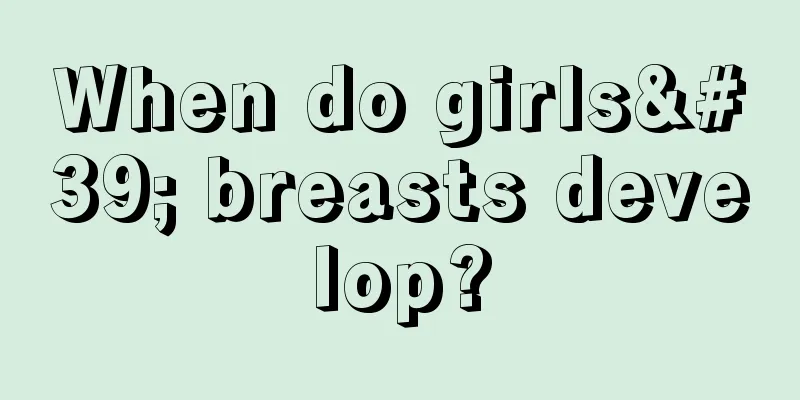 When do girls' breasts develop?