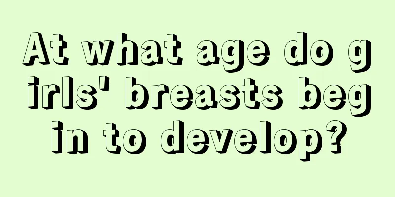 At what age do girls' breasts begin to develop?