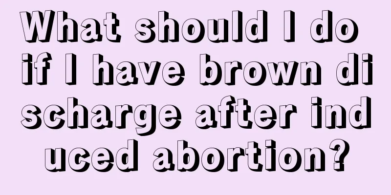 What should I do if I have brown discharge after induced abortion?