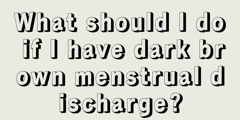 What should I do if I have dark brown menstrual discharge?