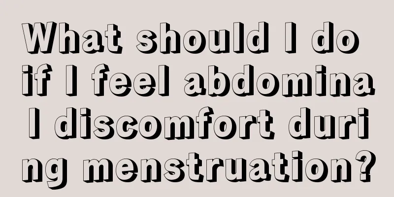 What should I do if I feel abdominal discomfort during menstruation?