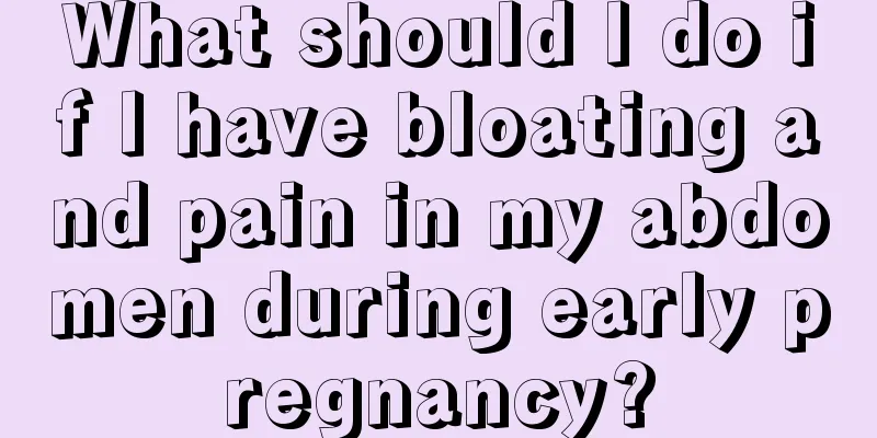 What should I do if I have bloating and pain in my abdomen during early pregnancy?