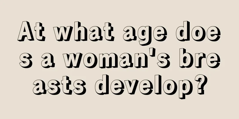 At what age does a woman's breasts develop?