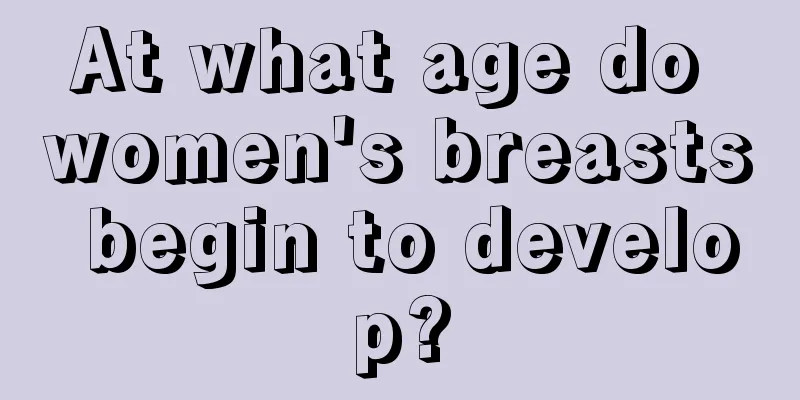 At what age do women's breasts begin to develop?