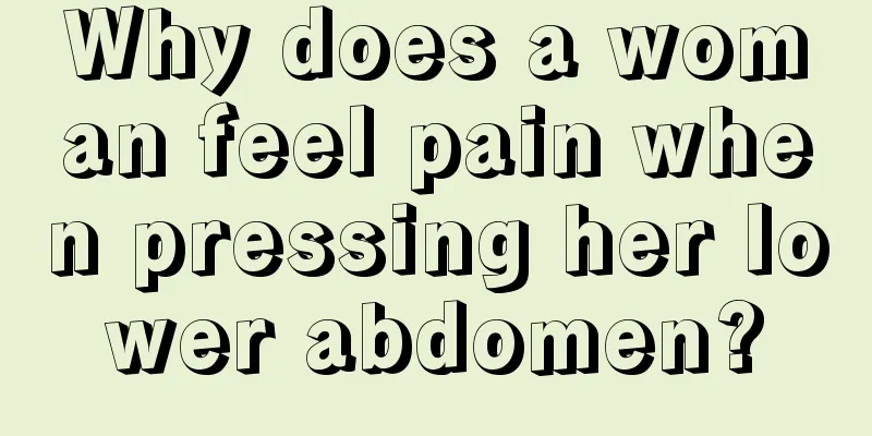 Why does a woman feel pain when pressing her lower abdomen?