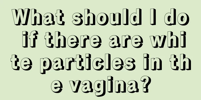 What should I do if there are white particles in the vagina?