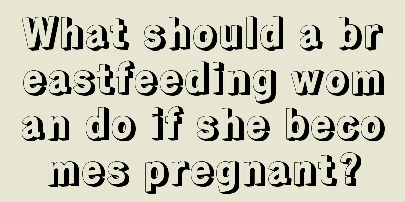 What should a breastfeeding woman do if she becomes pregnant?