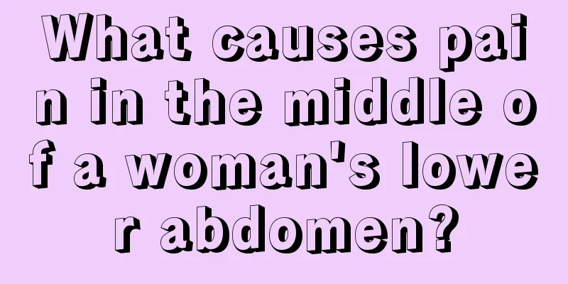 What causes pain in the middle of a woman's lower abdomen?