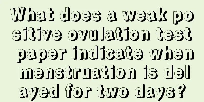 What does a weak positive ovulation test paper indicate when menstruation is delayed for two days?