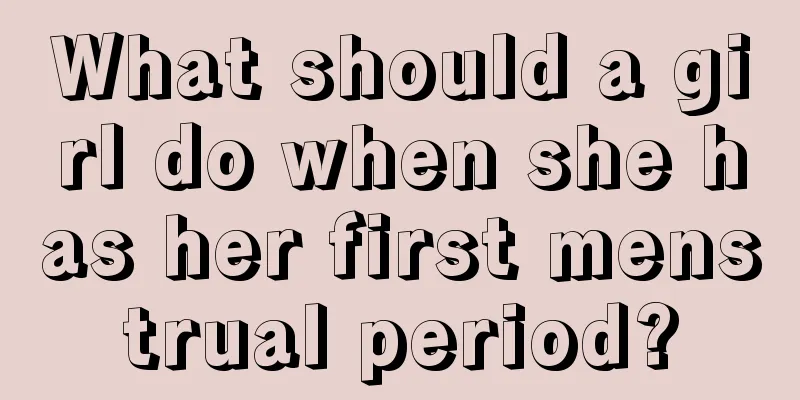 What should a girl do when she has her first menstrual period?