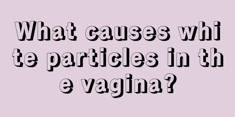 What causes white particles in the vagina?