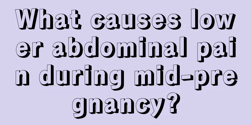 What causes lower abdominal pain during mid-pregnancy?