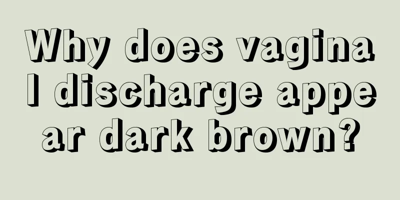 Why does vaginal discharge appear dark brown?