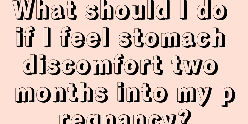 What should I do if I feel stomach discomfort two months into my pregnancy?